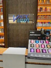 Vape store interior with display of electronic cigarettes, vape pens, and e-liquids at Emirates Vape Shop in Dubai.